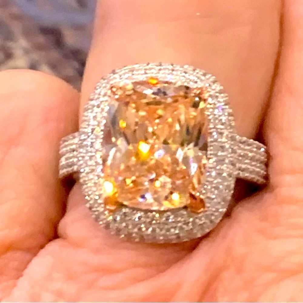 Size 7 champagne cocktail ring with white czs around and down the shank .